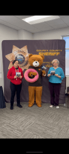 Deputy Brown Bear at a booth